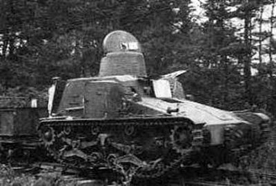 Type 95 armoured railroad car So-Ki (九五式装甲軌道車) on tracks, pulling some cars