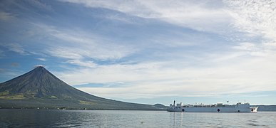 USNS Mercy (T-AH-19) anchored off Mayon in July 2016