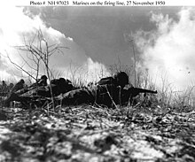 Weapons Company, in line with Headquarters and Service Company, 2d Battalion, 7th Marines, trying to contact the temporarily cut off Company F in a glancing engagement to permit the 5th and 7th Marines to withdraw from the Yudam-ni area 27 November 1950. Usmc97023.jpg