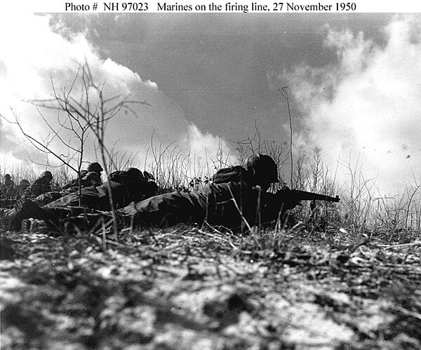 Weapons Company, in line with Headquarters and Service Company, 2d Battalion, 7th Marines, trying to contact the temporarily cut off Company F in a gl