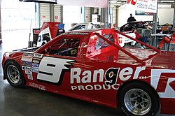 Pete Wilkinson's pickup being prepared for the first 2007 race Wilky garage.jpg