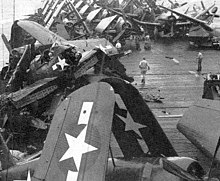 Wrecked aircraft strewn about the flight deck of Attu following Typhoon Connie. Wrecked aircraft on USS Attu (CVE-102) after typhoon in June 1945.jpg