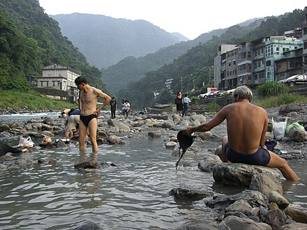 Make your own hot spring rock pool on the banks of the river.