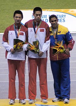 Zhang Xiaoyi, Yu Zhenwei, Víctor Castillo 2011.jpg