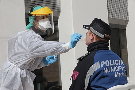Local police officer in Madrid is tested for coronavirus, 25 March.
