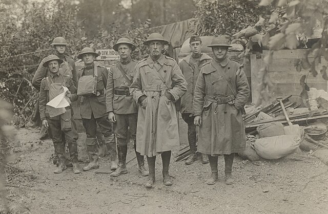 Major General McMahon (center), commander of the 5th Division, and members of his staff in France, October 15, 1918. Stood to the left of McMahon is h