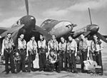 Members of No. 456 Squadron in front of a Mosquito aircraft in 1943