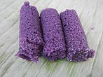 Puto bumbong, steamed rice cakes made with purple glutinous rice, steamed in bamboo tubes