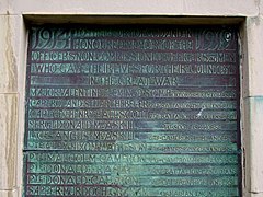 A discoloured brass plaque showing the names of those local men killed in the First World War