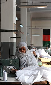 Afghan seamstress sews fabric used for the Afghan Military 2010