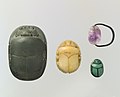 Scarab beetles were one of the most common material objects made by the ancient Egyptians. These scarabs, from the Middle Kingdom, were likely used as jewelry, specifically amulets. The scarab beetle is symbolic of Khepri, the Egyptian sun deity who represents creation and rebirth[9].