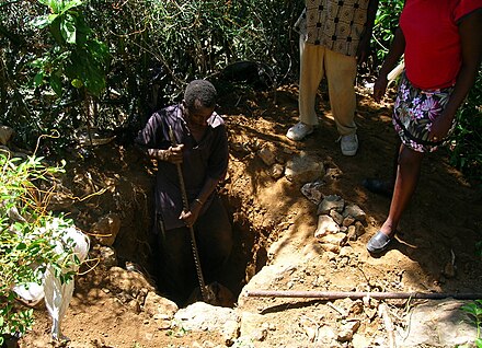 Digging the pit for an Arborloo, a type of pit toilet in Cap-Haitien, Haiti