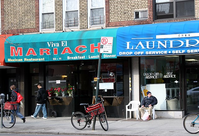 Mexican restaurant and shops in Astoria, Queens, NYC, United States.