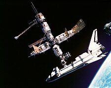 The Soviet Space Station MIR docking with American Space Shuttle Atlantis in 1995.