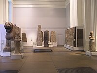 Group displayed in the British Museum, including a lion from a temple entrance, and the Black and White Obelisks