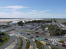 New parallel runway under construction with domestic terminal road approaches in foreground