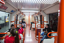 Passengers on board a CAF 6000 train CAF 6000 Interior.jpg