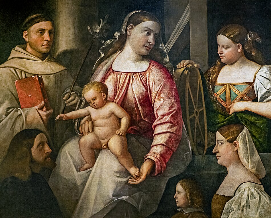 https://upload.wikimedia.org/wikipedia/commons/thumb/8/8c/Ca%27_Rezzonico_-_Madonna_col_Bambino_e_i_Santi_Antonio_da_Padova_e_Caterina_d%27Alessandria_con_i_tre_donatori_%28Inv.13%29_-_Giovanni_Cariani.jpg/951px-Ca%27_Rezzonico_-_Madonna_col_Bambino_e_i_Santi_Antonio_da_Padova_e_Caterina_d%27Alessandria_con_i_tre_donatori_%28Inv.13%29_-_Giovanni_Cariani.jpg