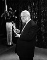 Carl Laemmle holding an Oscar trophy, 1930.jpg