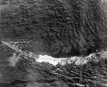 The Japanese cruiser Chikuma maneuvering after sustaining torpedo damage. ChikumaLeyte.jpg