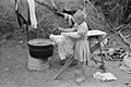 "Child_of_white_migrant_worker_ironing_in_camp_near_Harlingen,_Texas,_8a25248.jpg" by User:Yann