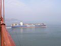 Container Ship Passing under the Golden Gate Bridge (16270598446).jpg