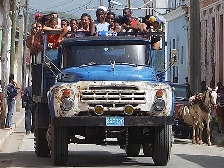 Riding in the back of a truck in Cuba