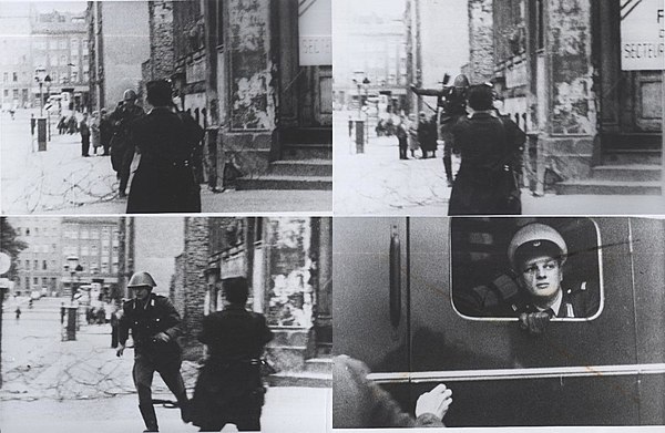 Konrad Schumann, an East German border guard, fleeing East Germany towards West Germany in 1962