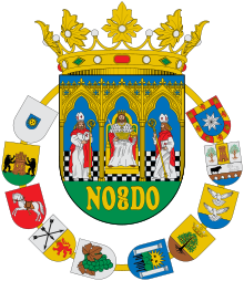 Escudo de la provincia de Sevilla, donde se puede apreciar una representación del escudo de Utrera en versión simplificada (segundo por la derecha del collar).