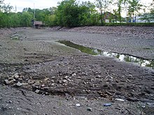 The bed of the Lower Fox River in Appleton during bridge repairs FoxRiverWisconsinRiverbed.jpg