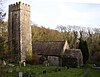 Gumfreston Church of St Lawrence. Outside there is the shaft of a churchyard cross, and three medicinal springs rise in the churchyard, the water of which contains iron and chalybeate. In the wood to the south of the churchyard wall are the ruins of the village that stood beside the quay on the river estuary. This was a transfer point for goods from the road to little coasting vessels. It was also on the pilgrimage route across south Wales to St David's.