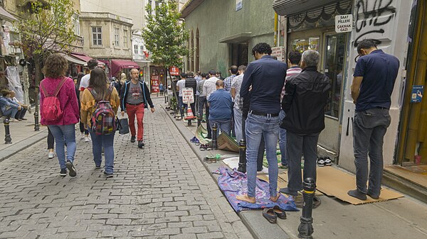 Muslims praying in the streets of Istanbul.