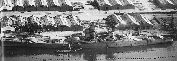 Jean Bart incomplete in Casablanca harbor, taken from an airplane of USS Ranger