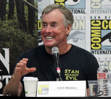 McGinley speaking at the Stan Against Evil panel during the 2017 Comic-Con International at the San Diego Convention Center JohnMcGinleyJanetVarneySDCC2017 (edited).png