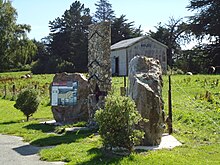 The Kelso Monument, showing flood levels; an old railway shed in the background Kelso Monument.JPG