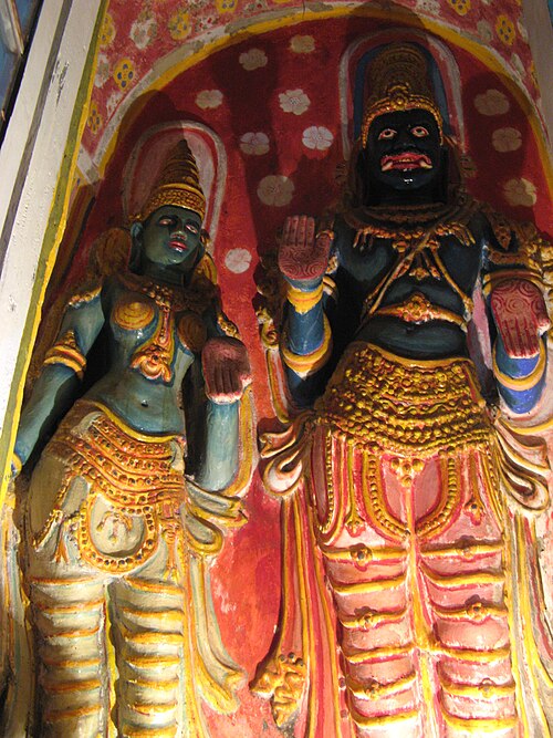 The statue in Lankatilaka Vihara of Vibhishana and wife is Sarama as in position of guardian deity of Sri Lanka