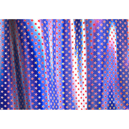 An example of a lenticular fabric sheet that changes from a blue background with white stars to a white background with red stars.