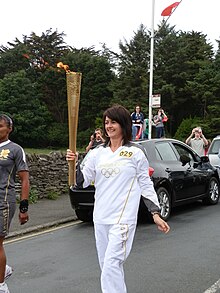 Day 15: The torch being carried through Onchan, Isle of Man. London 2012 Torch Relay - Isle of Man Day 15.JPG