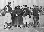 Milton Portmann (Left) shakes hands with Oberlin captain Glen Gray (Right) November 5, 1910