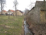 Čeština: Nesuchyňský potok v Nesuchyni. Okres Rakovník, Česká republika. English: Nesuchyňský potok (stream) in Nesuchyně village, Rakovník District, Czech Republic. This file was created as a part of the photographic program of Wikimedia Czech Republic. Project: Fotíme Česko The program supports Wikimedia Commons photographers in the Czech Republic.