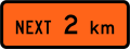 New Zealand road sign W1-1.1B (2 km).svg