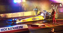 This top-fuel dragster can accelerate from zero to 160 kilometres per hour (99 mph) in 0.86 seconds. This is a horizontal acceleration of 5.3 g. Combining this with the vertical g-force in the stationary case using the Pythagorean theorem yields a g-force of 5.4 g. Nitrolympics TopFuel 2005.jpg