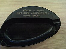 An old bakelite ash tray showing an example of a single digit phone number used in the early days of telecommunication. Old Ash Tray With Single Digit Phone No.jpg