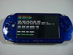 Prueba de color, espaciado, opacidad y sombreado de texto usando la frase «Hello world» en una PSP.