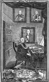 Luther at his desk with family portraits (Source: Wikimedia)