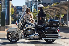 A San Francisco Police Department motorcycle officer speaking to a civilian San Francisco Police Department Motorcycle-9426.jpg