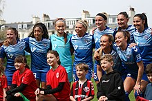 McAloon and team mates at Lewes WFC in 2023 Sarah Wilson (football) 5 Lewes FC Women 1 Durham 2 30 04 2023-140 (52861877111).jpg