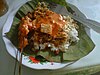 ''Sate serepeh'' served with ''nasi tahu'', laid on a teak leaf plate