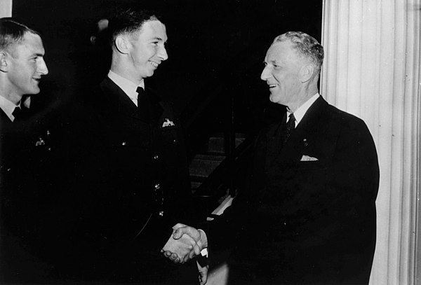 Senator Roy Kendall greeting two Air Force officers.jpg