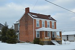 Smithfield-area brick farmhouse with large porch.jpg